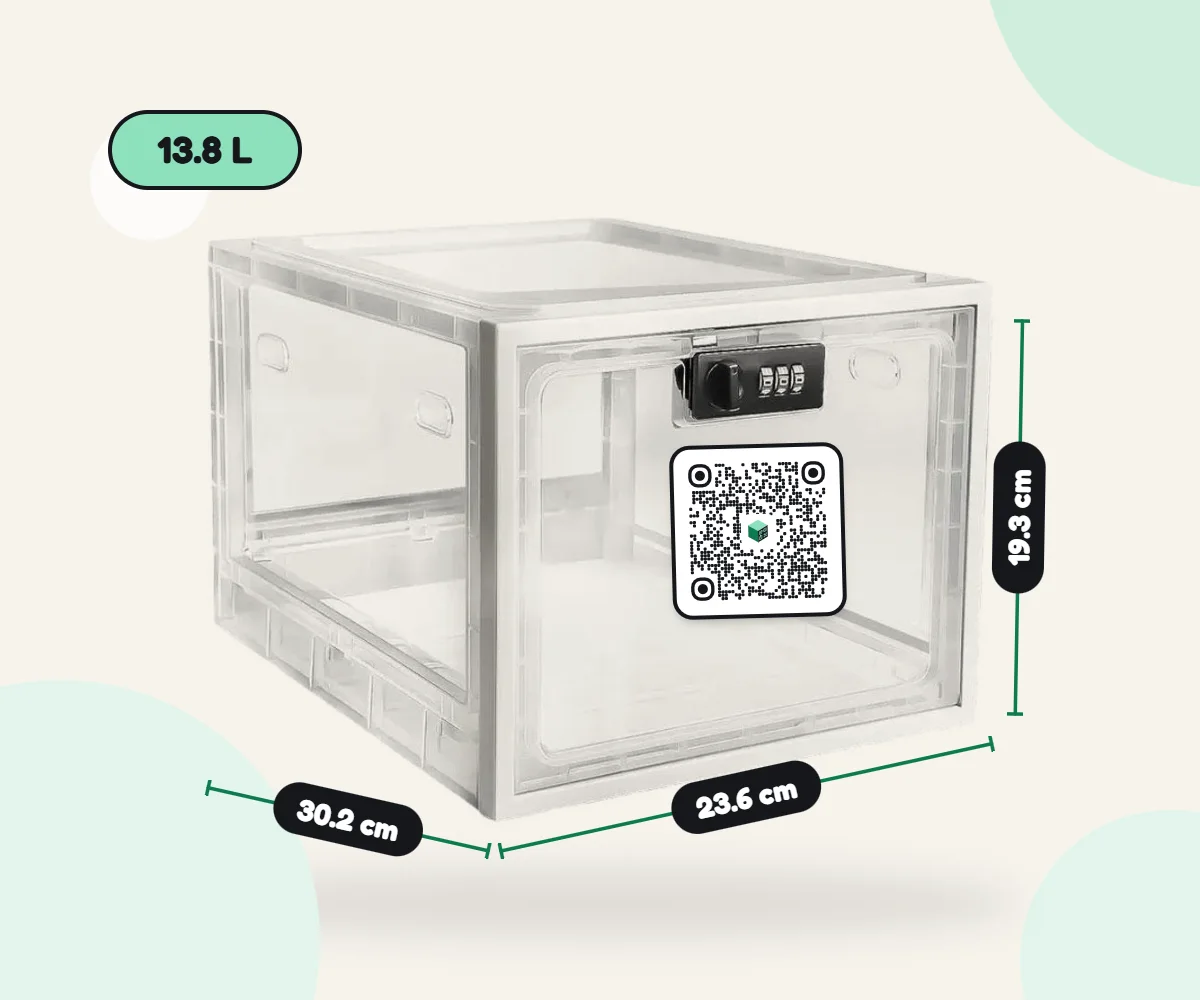 The clear Airbnbox lockbox with a combination lock, a bottle and a flute inside, and its dimensions: 23.6 × 30.2 × 19.3 cm